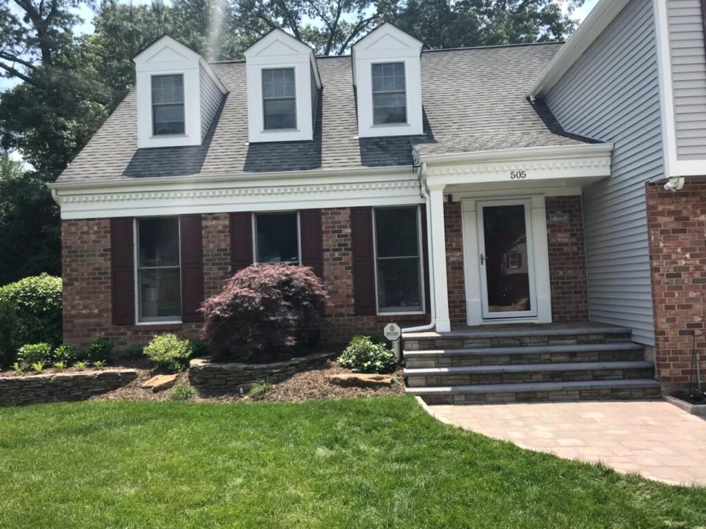 FRONT ENTRANCE: Belmont treads, Cast wall steps, Sandstone planting walls