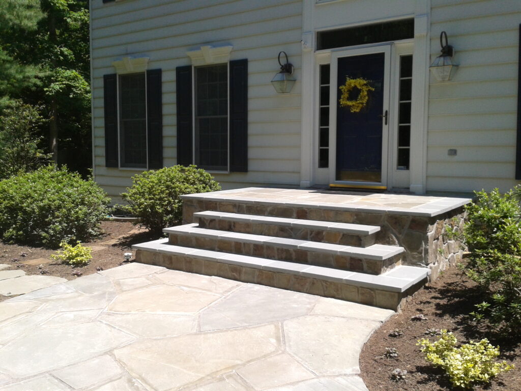 FRONT ENTRANCES - Veneer Western Md. wallstone steps, inslaid pad with Western Maryland Sandstone, Walkway and stepping stones