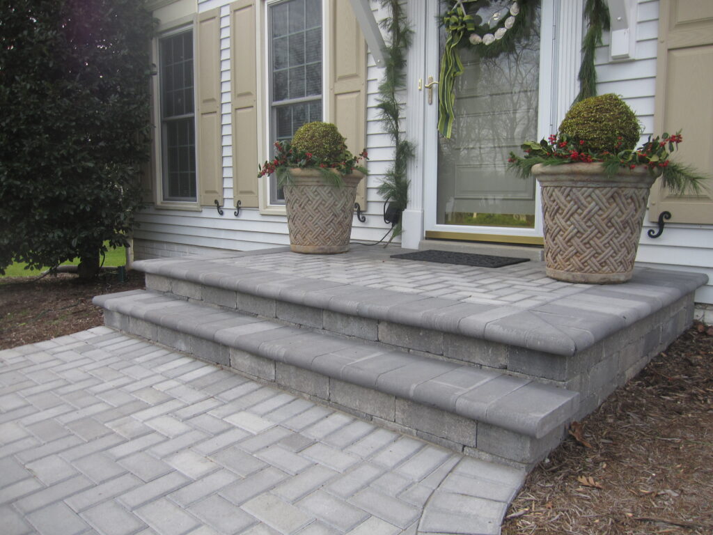 FRONT ENTRANCES - Paver bullnose border, brick paver inlay and walkway